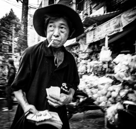 Ticket seller. Cho Lon district of Saigon, 2014.