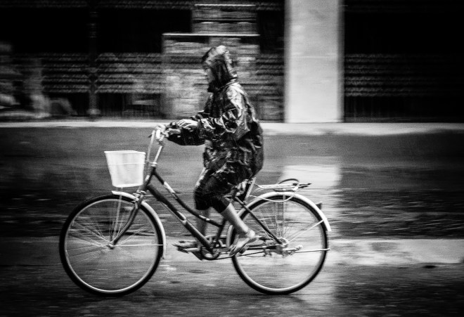 Cyclist in the rain. Bac Ha, Vietnam 2012.