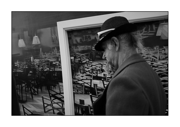 man-in-hat-before-cafe